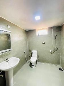 a bathroom with a toilet and a sink at Pap De Home in Weligama +12 photos