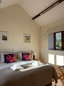 a bedroom with a large bed in a room at Cool Contours Venue in Eydon