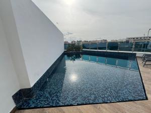 a swimming pool on top of a building at SKYLINE SUITES Tunisia in Tunis