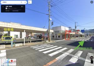 an empty street with a traffic light and a crosswalk at one space 泊まれるコワーキングスペース in Kawatana