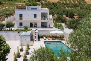 an aerial view of a house with a swimming pool at Villa Bizzarria in Castellammare del Golfo