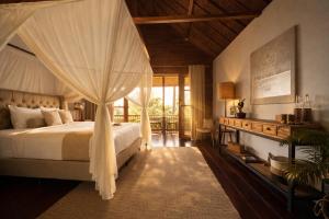 a bedroom with a bed with a canopy at Lempuyang Boutique Hotel in Karangasem +194 photos