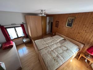 a bedroom with a large bed in a room at Turm an der Mauer in Ellwangen