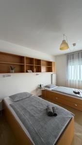 a bedroom with two twin beds at Hostel POINT Nova Gorica, Self Check-In with code access in Nova Gorica