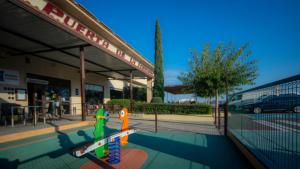 a building with a gym with a skateboard in front of it at Hotel Puerta de la Serrania in Lliria