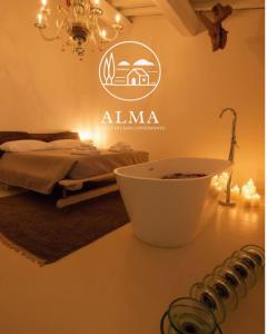 a room with a bed and a counter with a sink at Alma Capodimonte Lake chalet in Capodimonte +22 photos