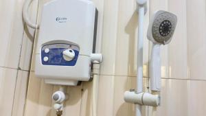 a security device on the wall of a hospital room at Safari Homes in Kampala +22 photos