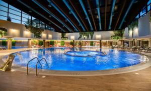 a large pool in the middle of a building at Apartmani Trg Zlatibor in Zlatibor
