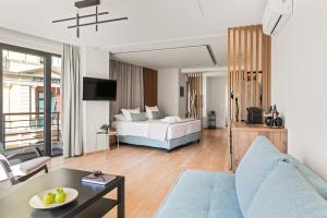 a hotel room with a bed and a living room at Bedspot Heraklion in Heraklio +32 photos