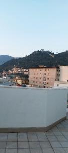 a white wall with a view of a city at La casa di Ely in Sarno