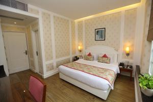 Postel nebo postele na pokoji v ubytování Hotel Bright