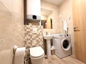 a bathroom with a washing machine and a washer at Odmor u Podgorici. in Podgorica +21 photos