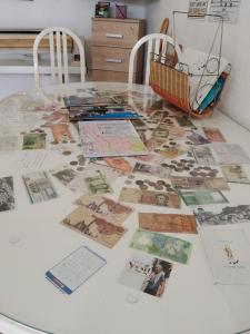 a table topped with lots of photos on top of it at Guest House LEA in Mostar