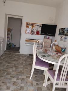 a dining room with a table and chairs at Guest House LEA in Mostar +17 photos