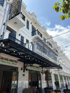 a white building with a sign for a hotel at THIÊN HÀ Motel in Soc Trang +42 photos