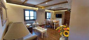 a living room with a couch and a table at Villa Desideri Agriturismo Dinoabbo in Lucinasco