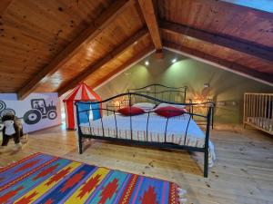 a bedroom with a bed in a attic at Hiža Bepina in Marčana