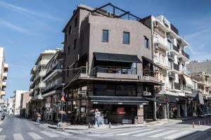 a building on the corner of a city street at Bedspot Heraklion in Heraklio