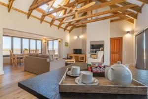 a living room with a table with cups on it at Quagga River Lodge in Velddrif +22 photos