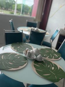 a table with plates and napkins on top of it at Hotel Pedra da Letra in Mauriti +4 photos