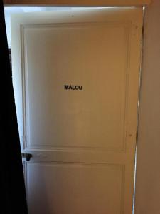 a door with the word malu written on it at Maison Parnasse in Castelnau-de-Guers