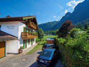 a couple of cars parked in front of a building at Haus Thiele in Schönau am Königssee