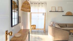 a living room with a couch and a table at Casa Alegra Pool & Spa in Gran Alacant +45 photos
