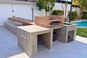 a patio with a table and a fire pit at Casa Alegra Pool & Spa in Gran Alacant
