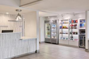 a restaurant with two refrigerators in a room with at SpringHill Suites Prescott in Prescott