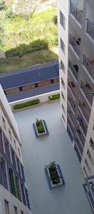 an overhead view of a courtyard in a building at Little Haven Stays-Near UN & Two Rivers in Ruaka