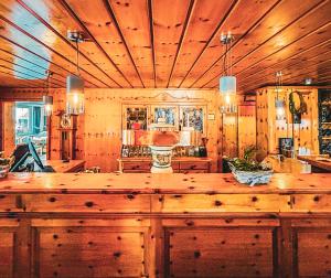 a large kitchen with a large wooden counter top at Hotel Zur Erholung in Braunlage