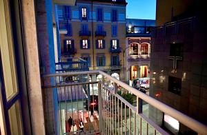 a view of a city street at night from a balcony at Brera Elegant in Milan