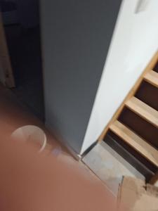 a corner of a room with a wall and some stairs at Logement Sierentz proche aéroport in Sierentz