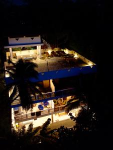 a view of a building at night with lights at CoCo-SuRf-House, Luxury among palms in Hikkaduwa