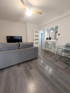 a living room with a couch and a table at Apartamentos Crispin Anais in Corella