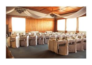 a large banquet hall with tables and chairs in it at Hotel Hrádok in Jelšava +20 photos