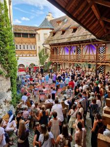 a large crowd of people standing in front of a building at Schloss Blumenfeld in Tengen +14 photos