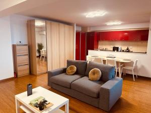a living room with a couch and a kitchen at Shiro in Bucharest