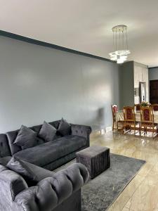 a living room with a couch and a table at Crompton Gardens 786 in Durban