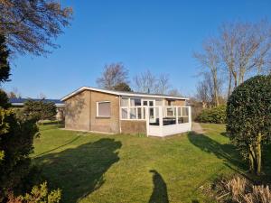 a home with a large yard with a house at De Snip in Ballum