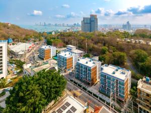 an aerial view of a city with tall buildings at Fourium Pattaya Hotel and Serviced Residence in Pattaya South