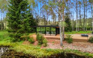 a pavilion in the middle of a park with trees at Luxury Resort Päikeseoru in Pedajamäe