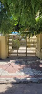 a gate in front of a building with a garage at CasaMora departamento céntrico con cochera gratis, 2 habitaciones in Almafuerte