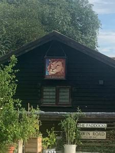 a building with a picture of a lion on it at The Little Red lion in Thorpe +7 photos