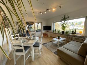 a living room with a table and a couch at Dokazien in Waldems