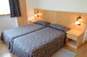 Postel nebo postele na pokoji v ubytování Hotel Giardino
