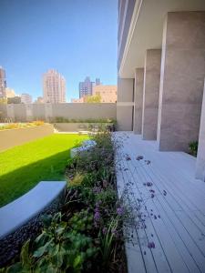 a garden on the side of a building at Studio Bliss in Neuquén