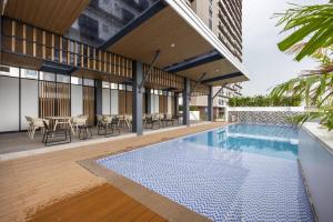 a swimming pool in the middle of a building at Layla by J&J At J Towers Residences It's just right next to SM JMall in Mandaue City