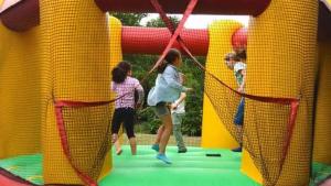 a group of children playing in a play structure at ZEcamping 3 pataugeoire animations locatif TV BBQ 24m2 4 pers in La Souterraine