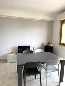 a dining room with a table and two chairs at La Casa Di Elda in Terni +25 photos